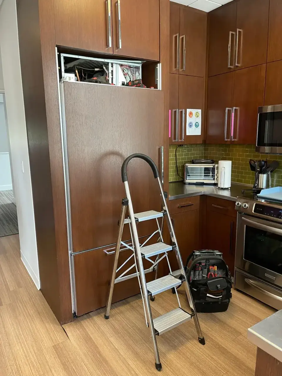 Appliance repair in progress by certified technician